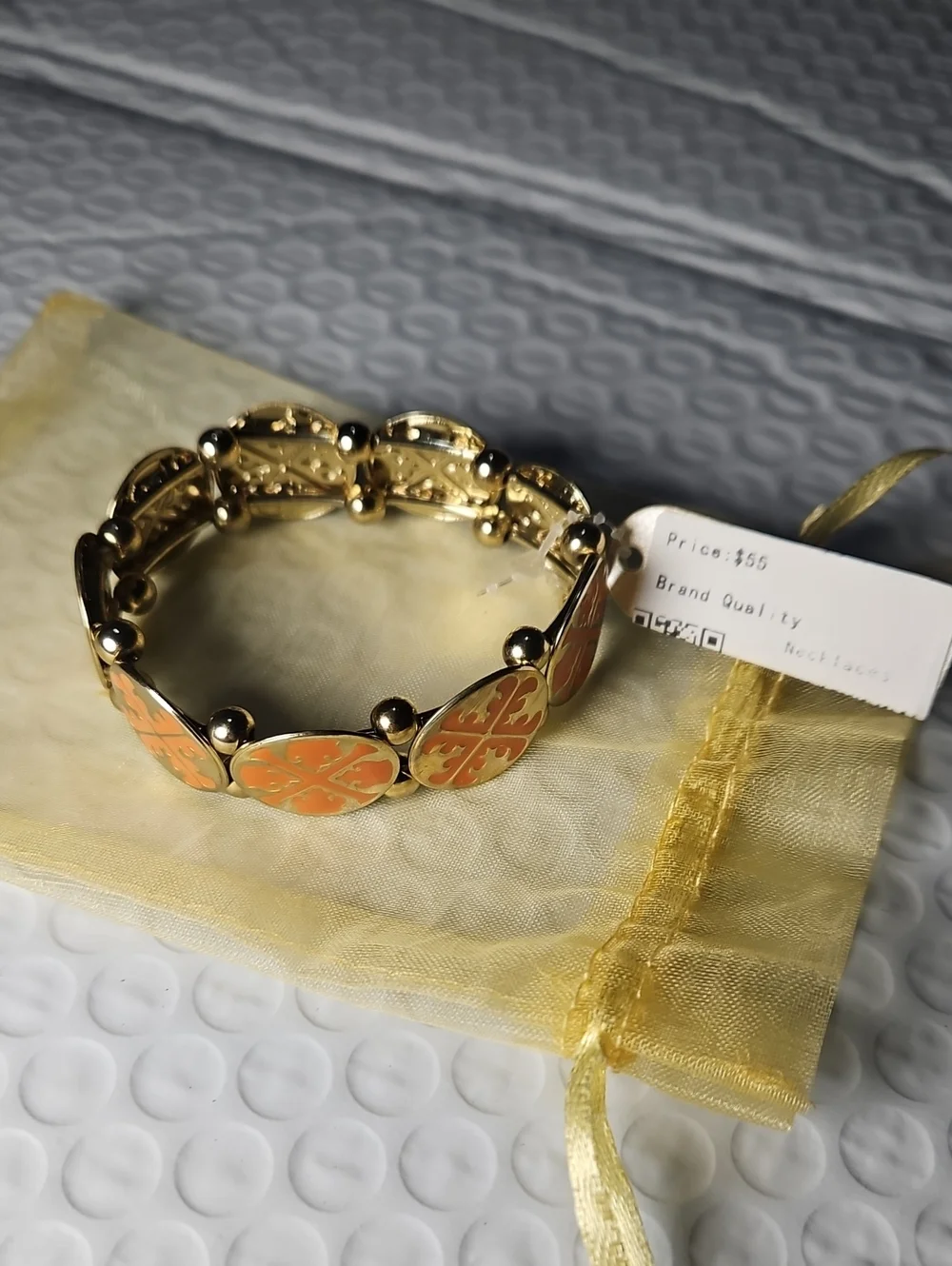 Tory Burch Gold-Tone Bracelet with Coral Orange Enamel Clover Motifs